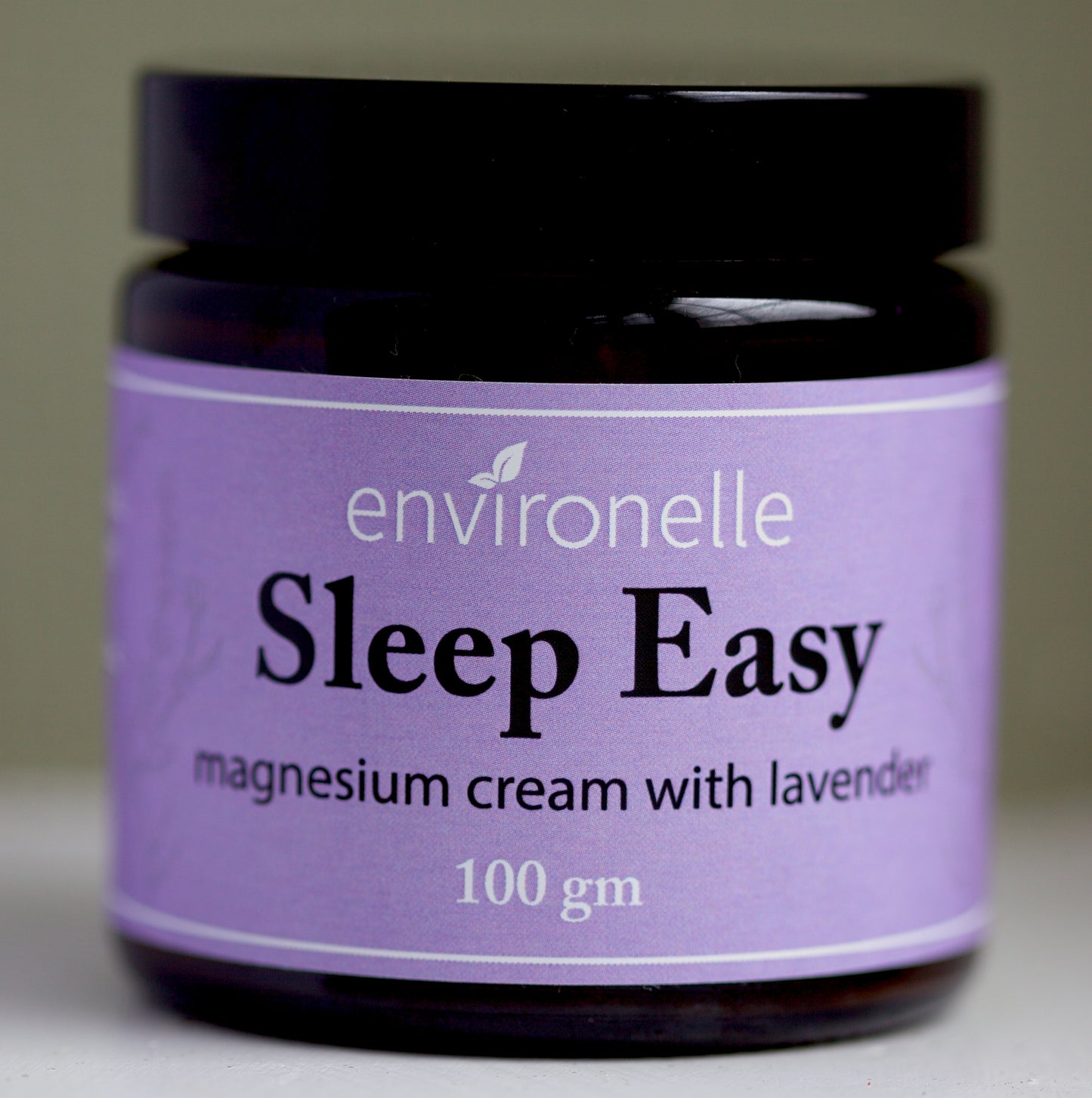 Jar of Environelle Sleep Easy magnesium cream with lavender on a neutral background