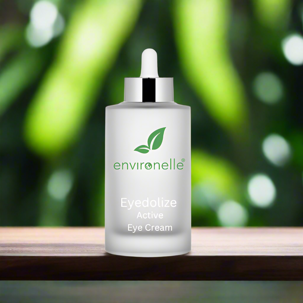 Environelle Eyedolize Active Eye Cream bottle on a wooden surface with a green blurred background