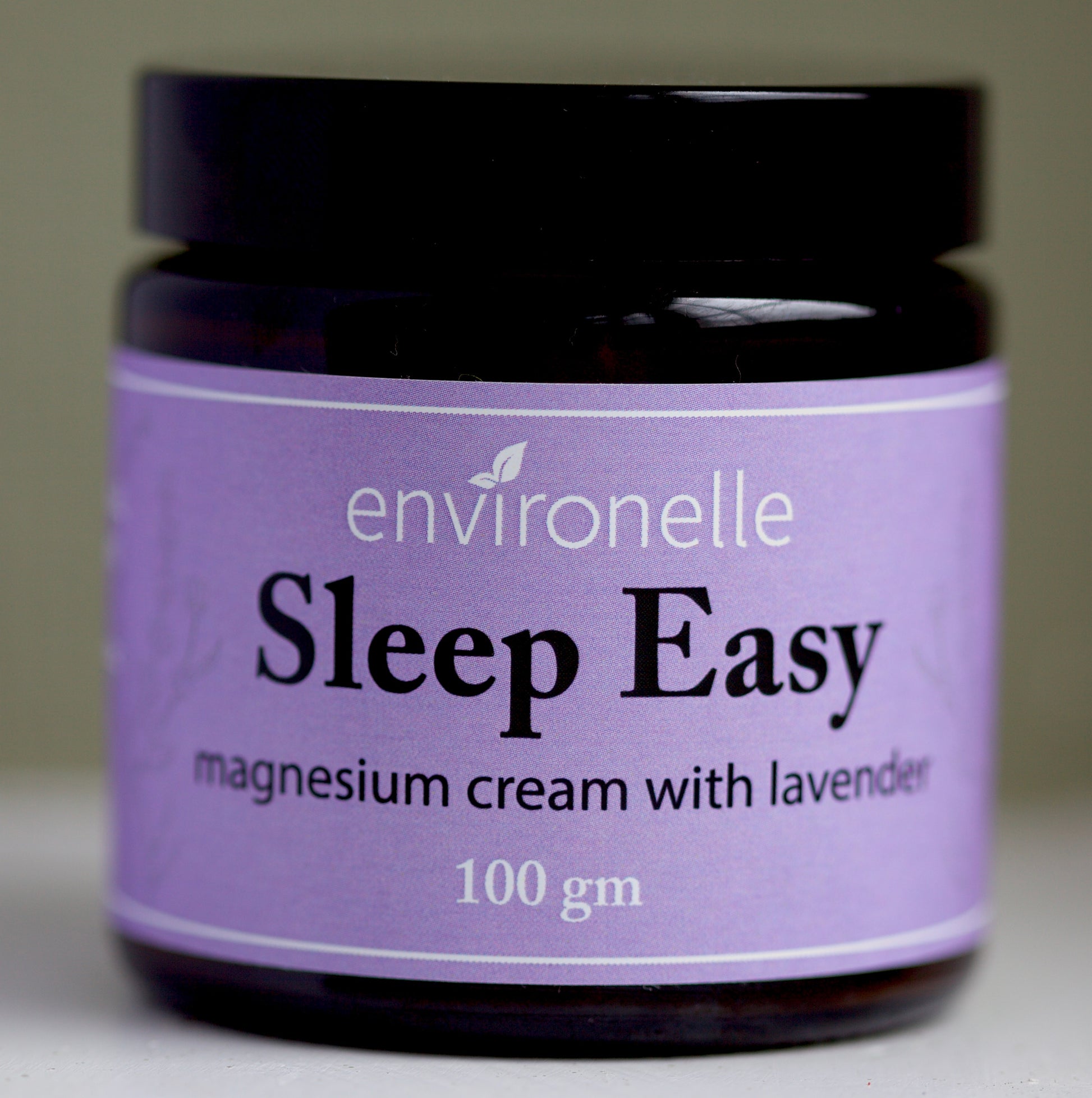 Jar of Environelle Sleep Easy magnesium cream with lavender on a neutral background