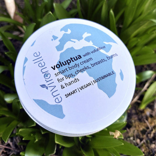 A tin of smart body cream on a leafy background 